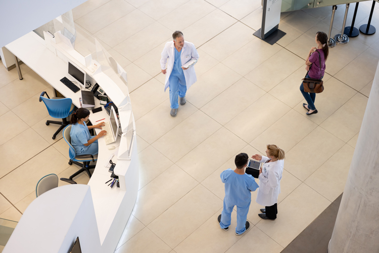 Medical center top view with staff and patients