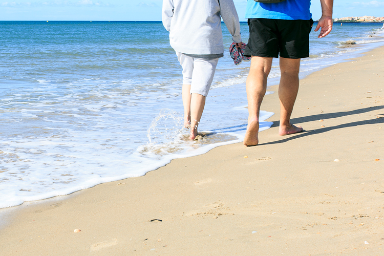 Retirement at the beach people walking on the sand