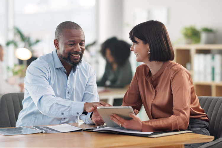 Two people discussing retirement plans