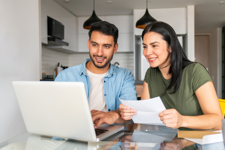 Two people looking at personal financial management webinars