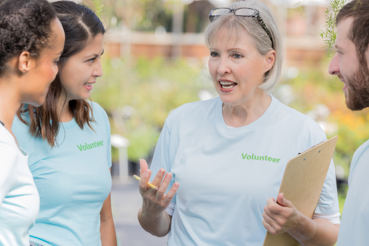 University volunteer at event speaking