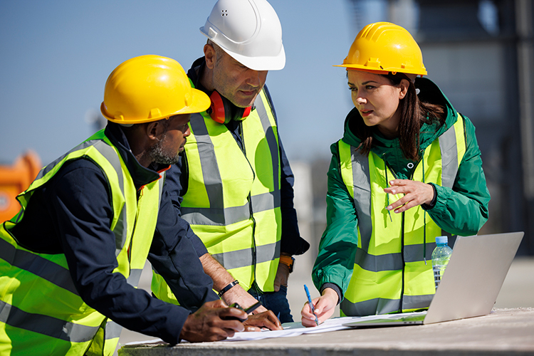Group of engineers discussing their plans