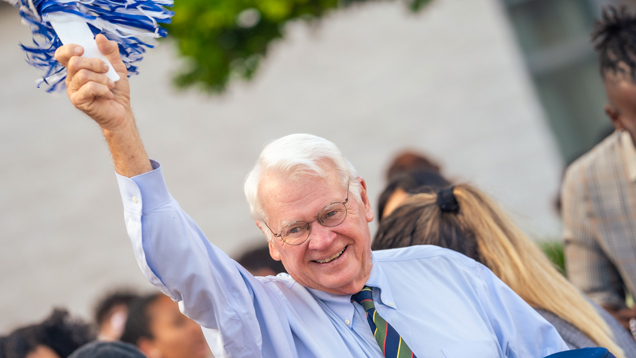 Dr. Moon at homecoming parade 2023 cheering