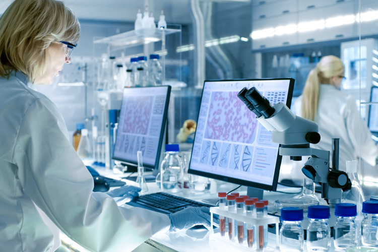 Scientist working on tech clinical systems biology laboratory