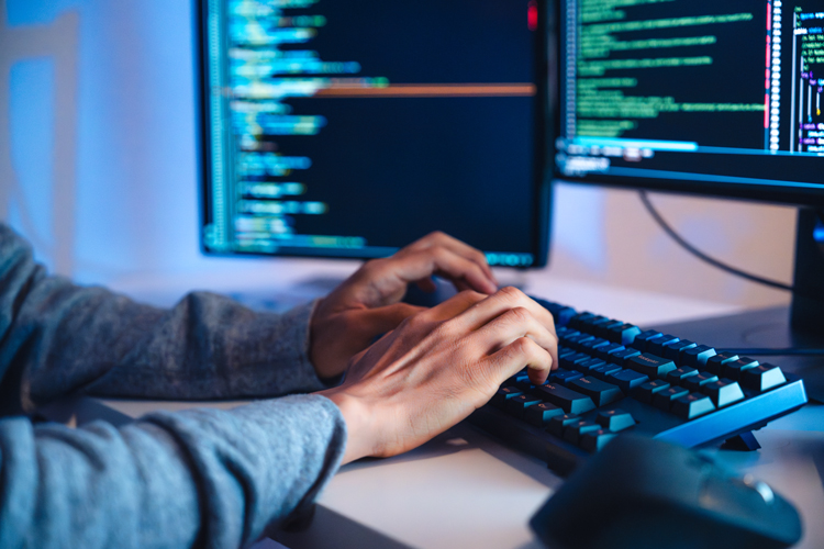 Engineer developing coding with software data program on computer