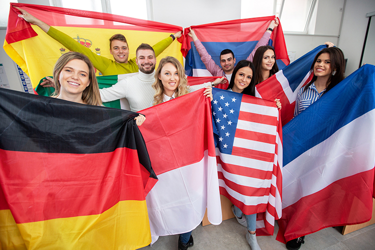 Group of students holding international flags