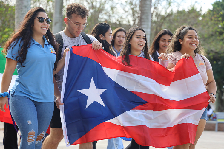 Group of students holding the Puerto Rican flag
