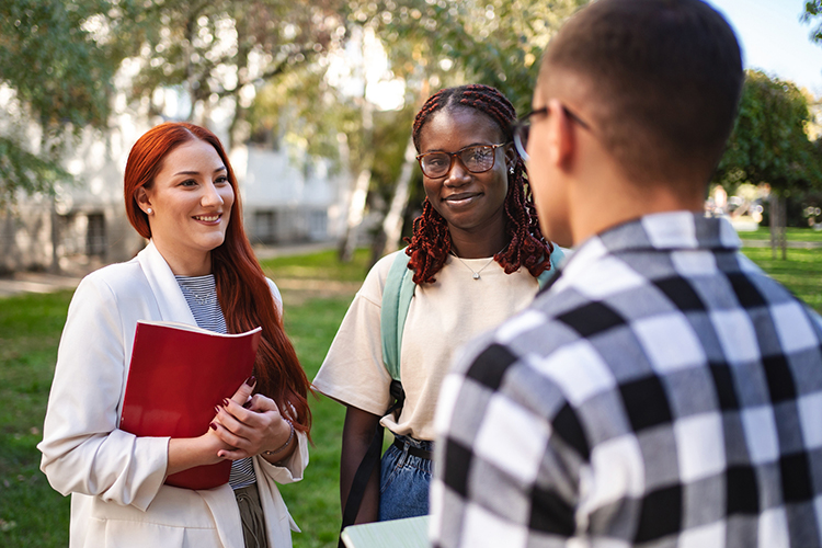 Group of students talking outdoors