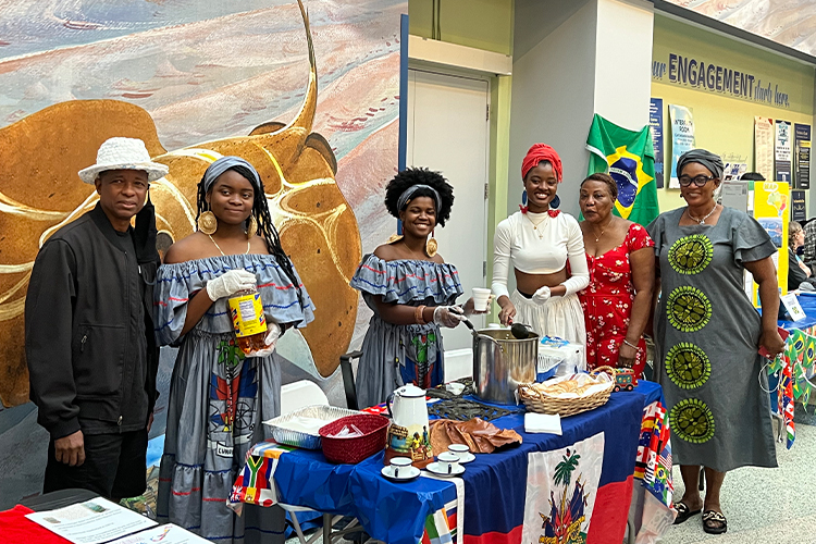 People serving food at an NSU event