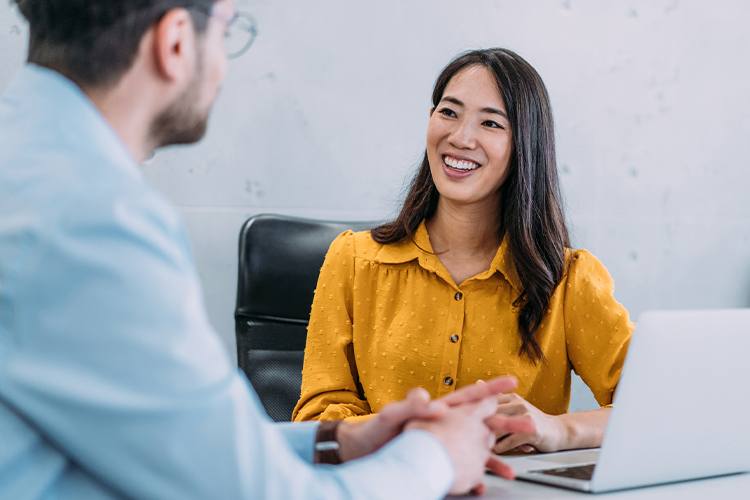 Two colleagues having a discussion in the office