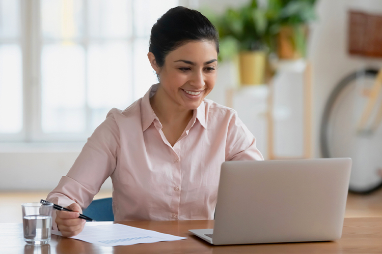 Woman working on laptop at home