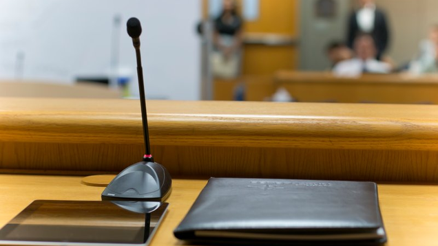 microphone and portfolio on courtroom desk