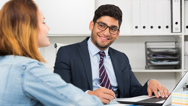 Suit attire men helping client with papers