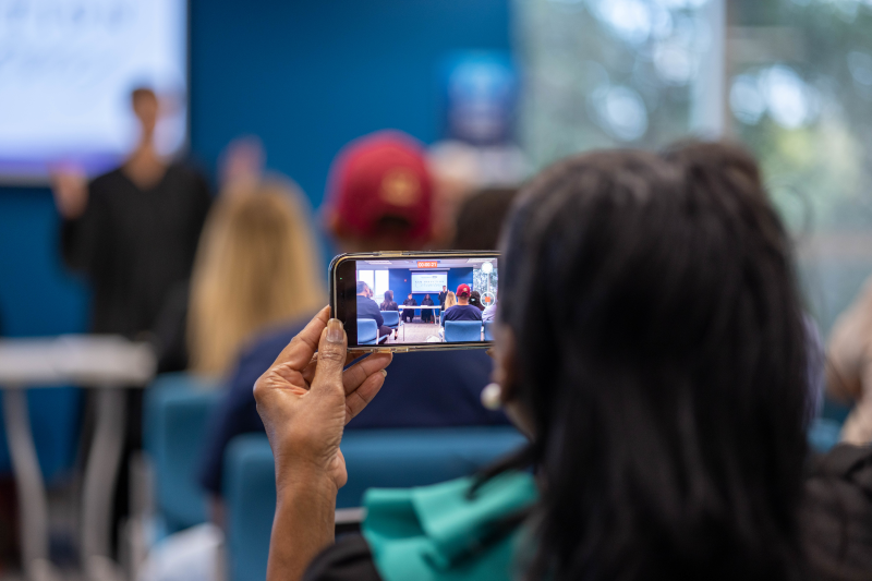 Alumni watching a presentation