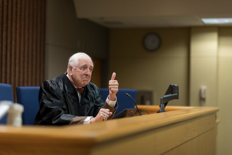 Judge in NSU courtroom giving thumbs up