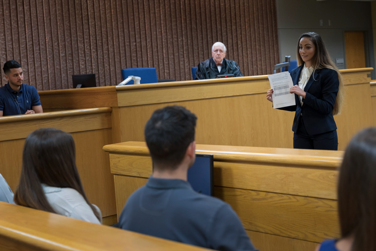 NSU student presenting in a mock trial