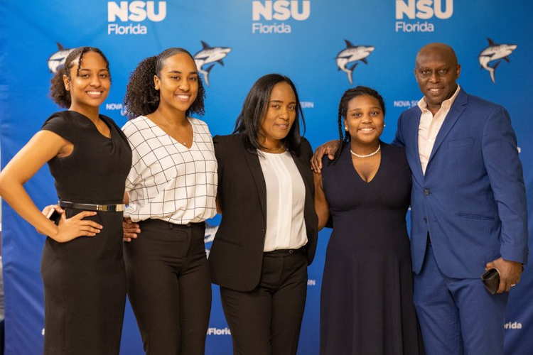group student photo with branded NSU logos in the background