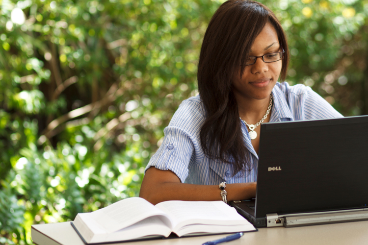 NSU law bachelor student studying on her computer