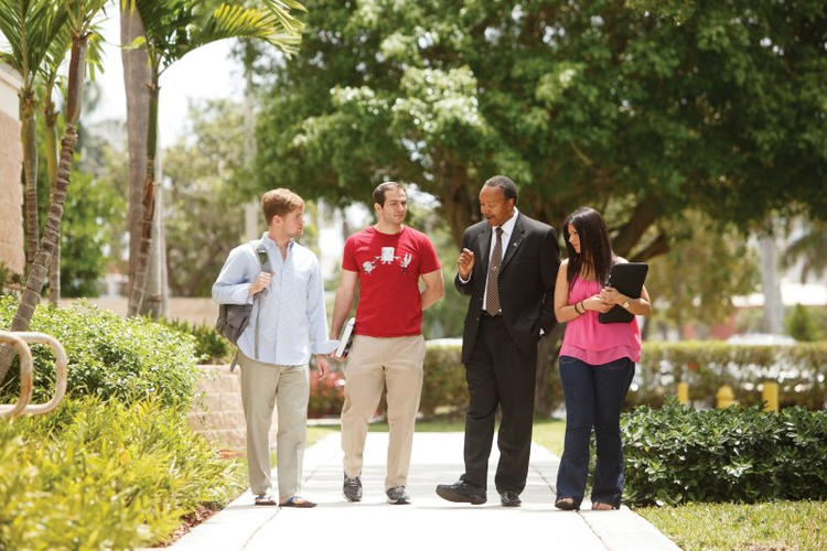 Three lawyers speaking on outdoor stairs