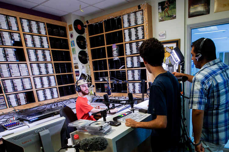 Three people at the mako radio