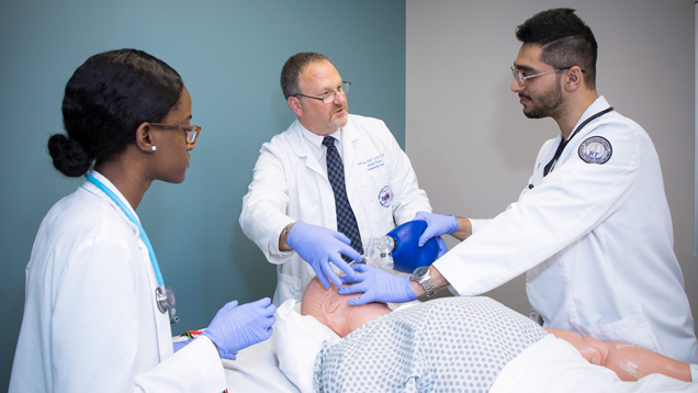 Respiratory students and professor guiding
