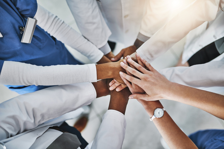 Diverse hands together