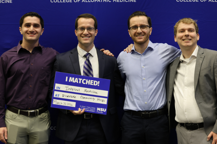 Students posing for hugging at Match Day event
