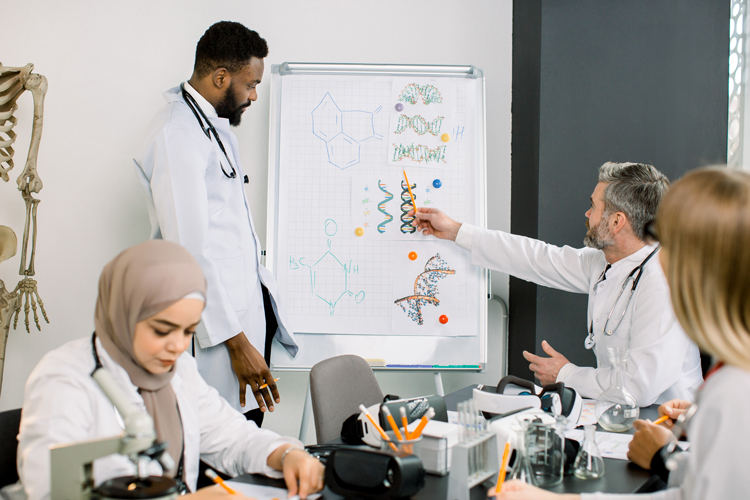 Teacher lecturing to group of medical students