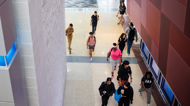 Students walking on hallway campus