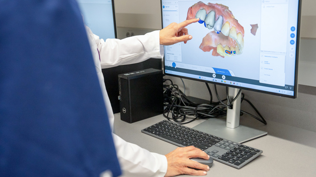 Dental medicine hand pointing to 3d teeth scan
