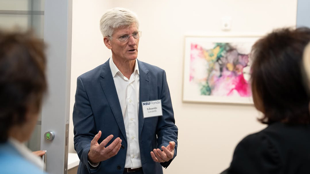 Eduardo Locatelli speaking to audience