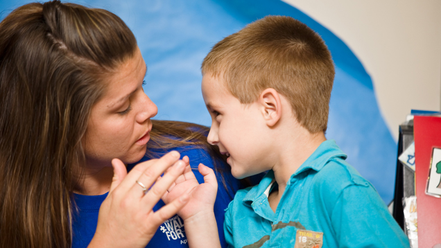 Professional helping autistic child