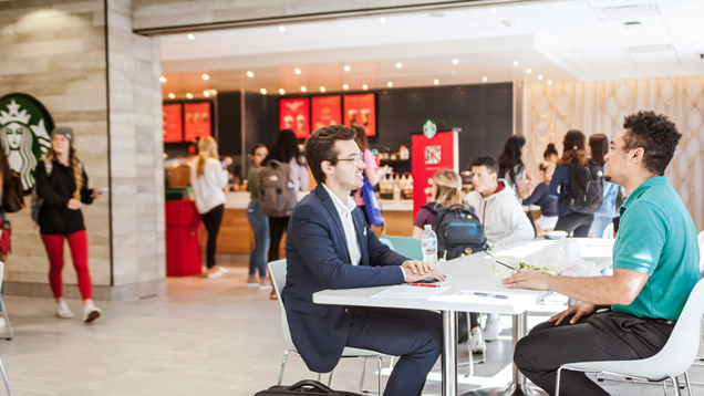 Students eating and chatting on NSU food court