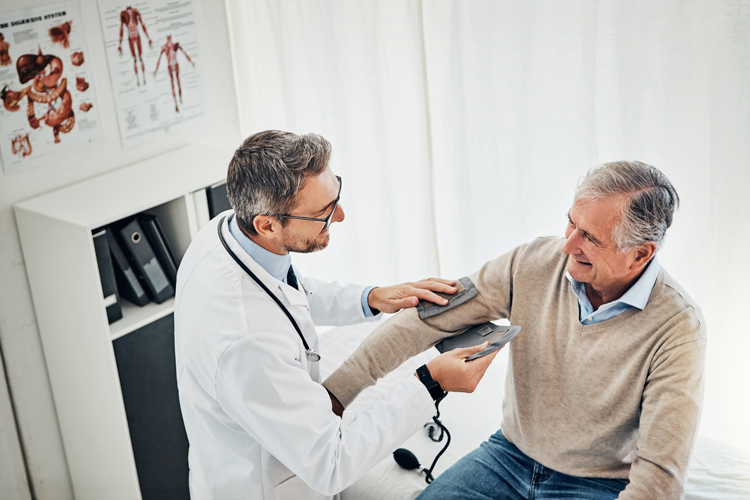 Person getting senior services blood pressure check