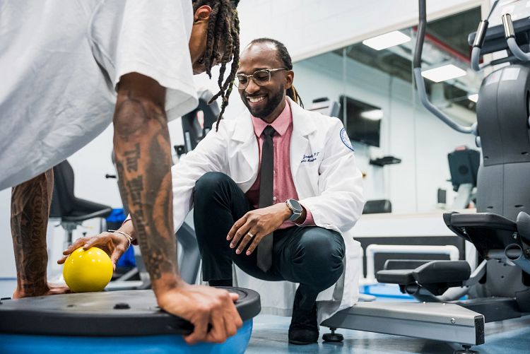Sports medicine doctor examining patient