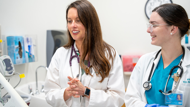 nursing professor teaching in lab