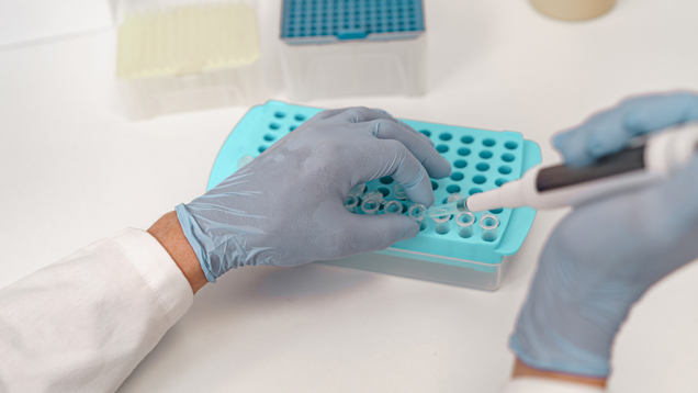 Hands closeup working on drug screening test in lab