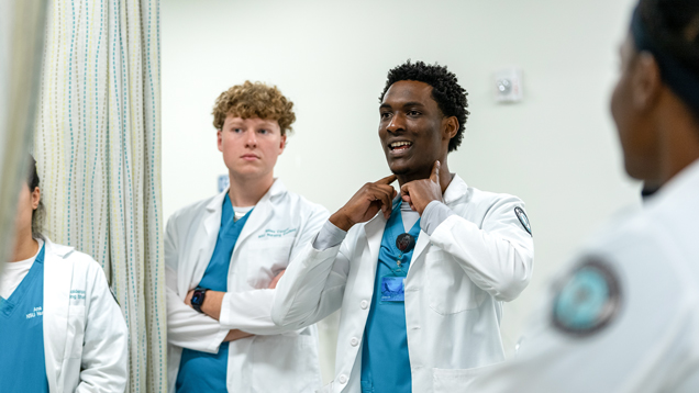 male nursing student doing demonstration in classroom