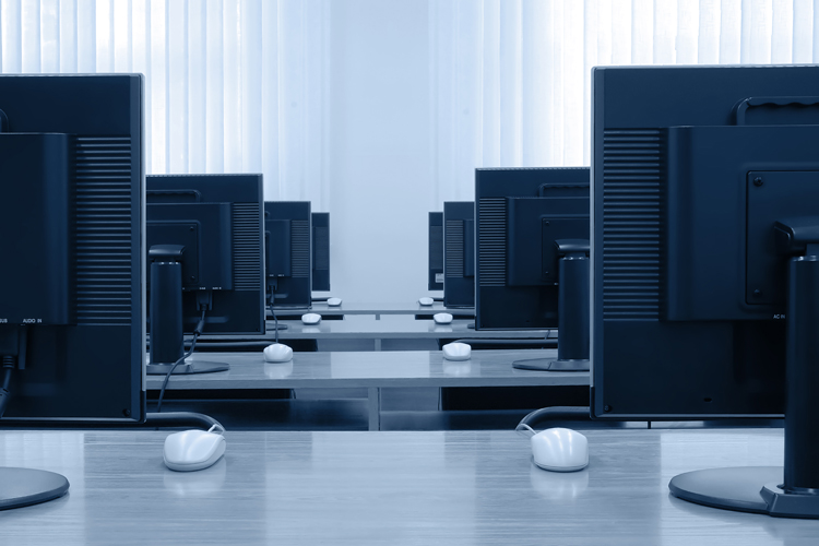 Bunch of desktop computers in room