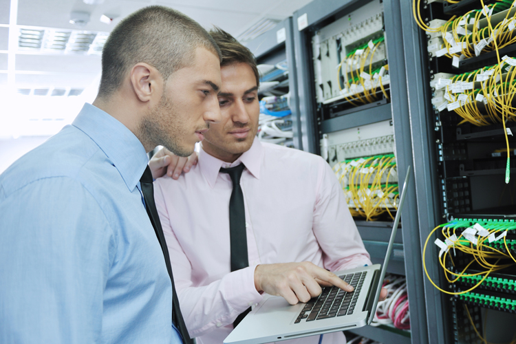 IT engineers in network server room