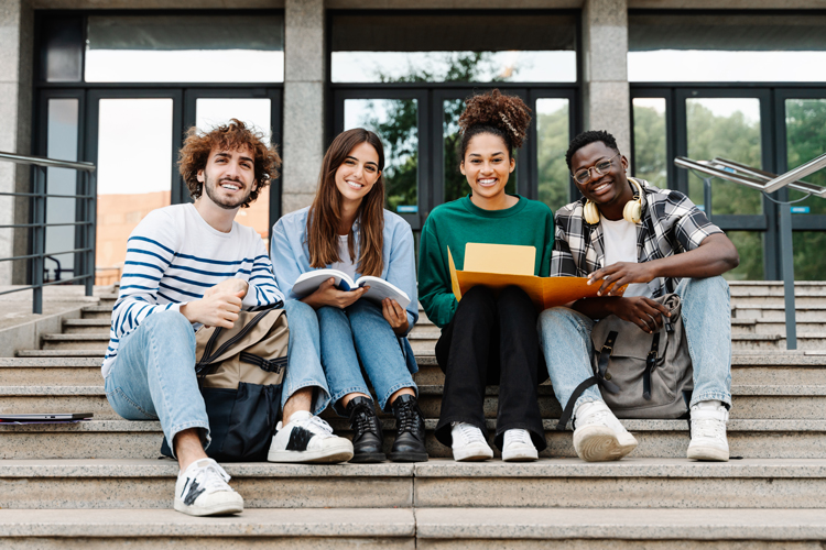 Students gathered on college stairs