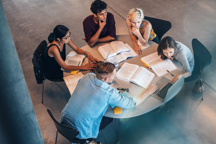 Studying group of students at the table
