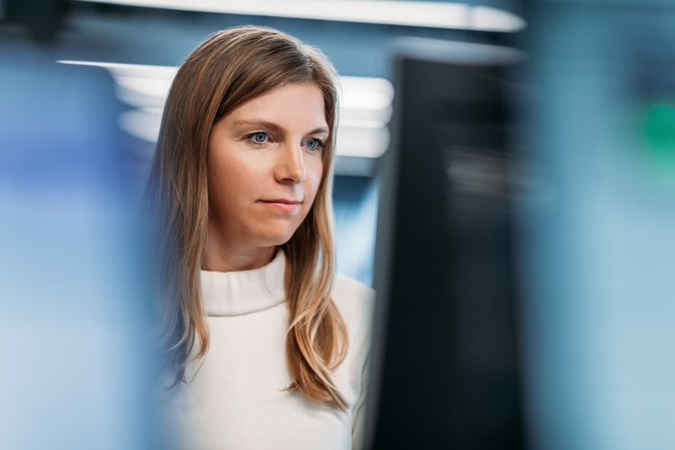 Woman looking at computer monitor