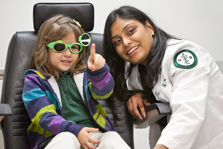 Alumni of optometry working with a child vision