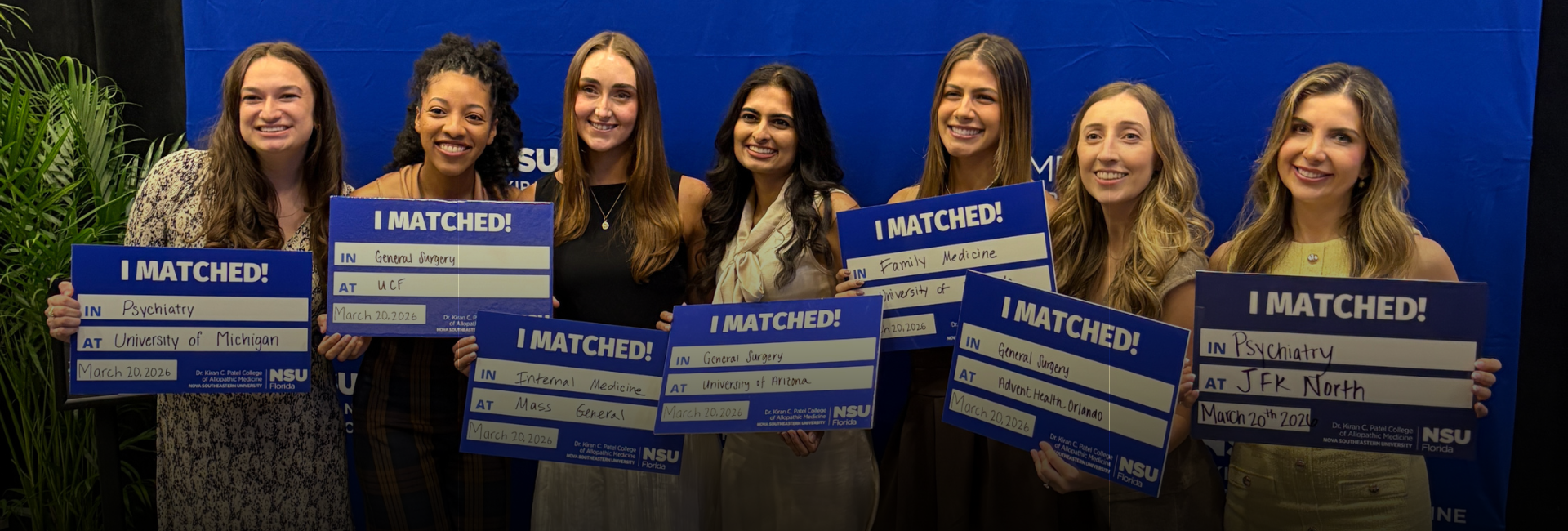 Group of faculty and students viewing monitor while student uses virtual reality goggles.