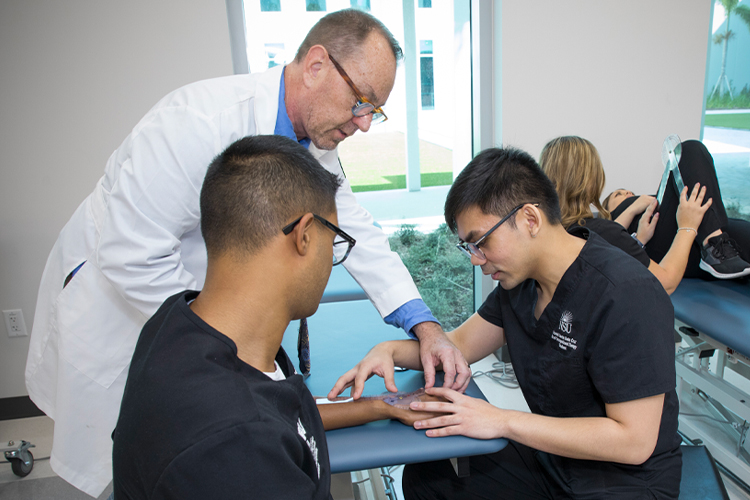Doctor helping occupational therapy students