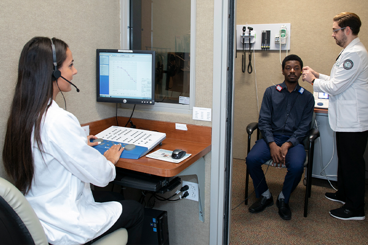 Doctors conducting a hearing examination