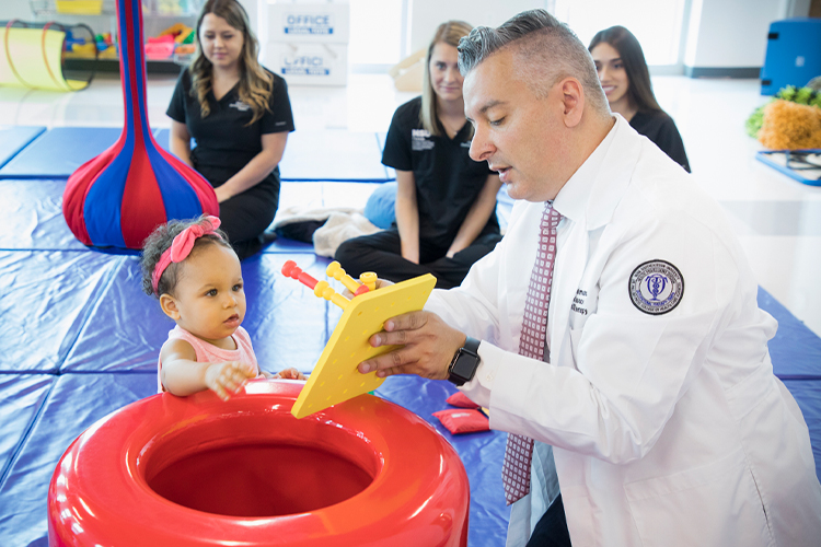 Occupational therapist helping a child