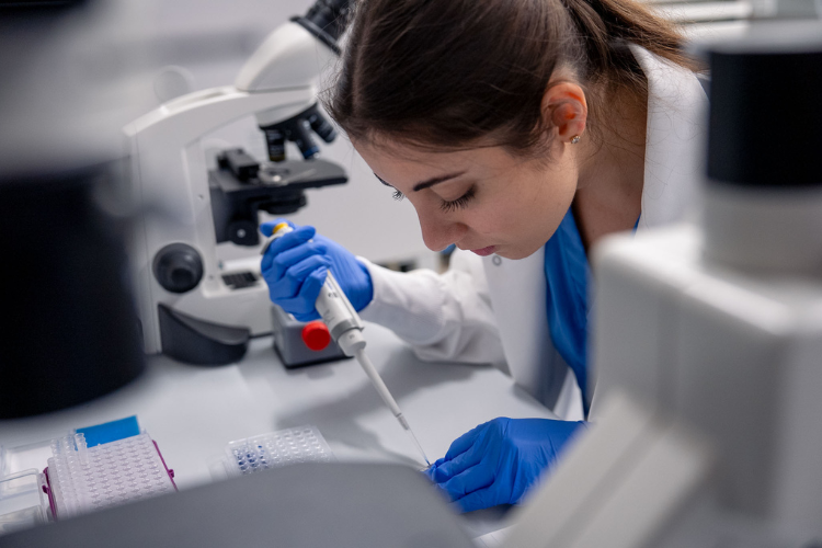 researcher using pipette