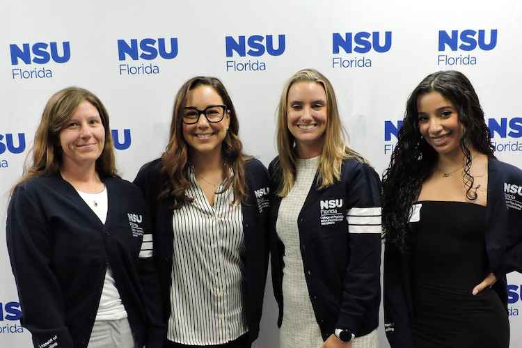 Four students at cardigan ceremony